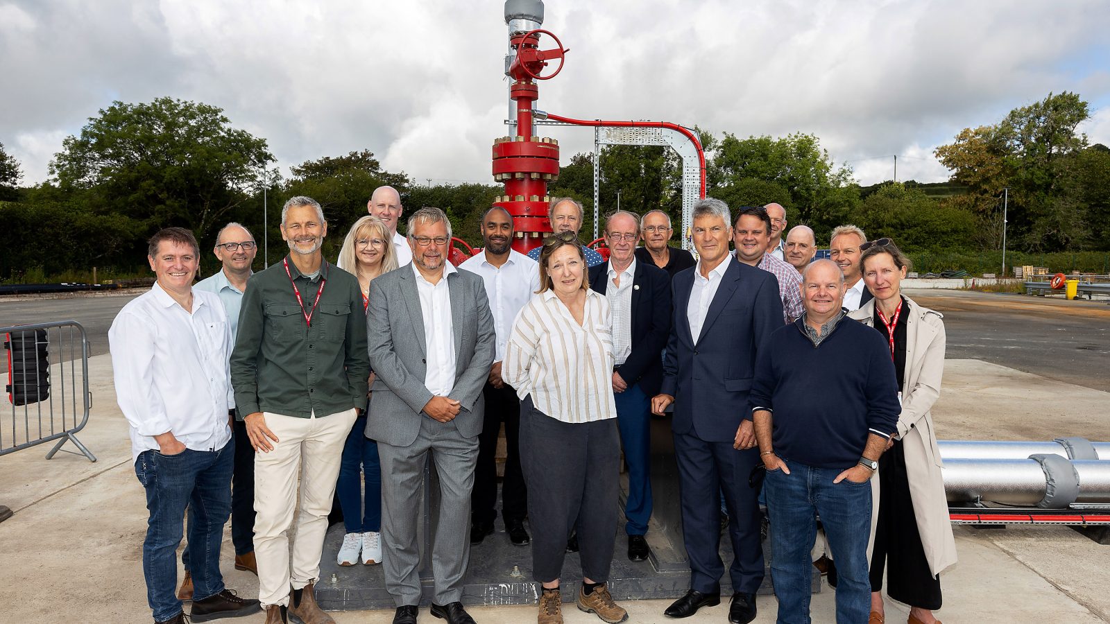 Sir Tim Smit and Gus Grand christen the well head (aka the 'Christmas tree'!) with Cornish Rum and are joined by members of the Geothermal team and other stakeholders.